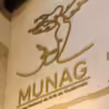Logo of the National Museum of Guatemalan Art on an interior wall of the museum saying "MUNAG: Museo Nacional de Arte de Guatemala"