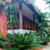 Building exterior at Hotel Camino Real Tikal on Lake Petén Itzá in Guatemala