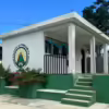 Exterior of office at The Little Mountain School showing the school's logo that reads "Colegio La Montañita, Joya Honda, GT"